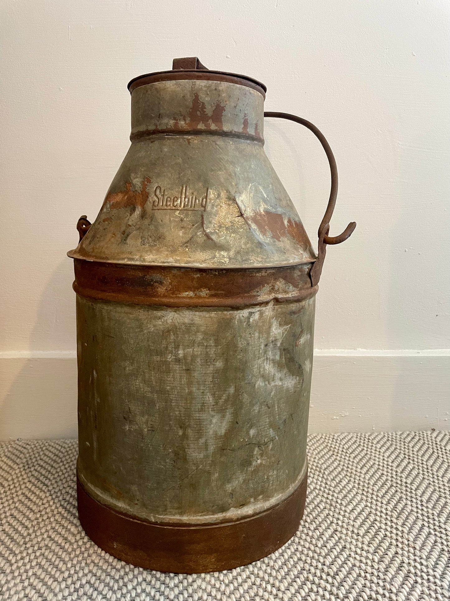 Large distressed metal milk churn